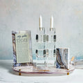 Agate Hadlokas Neiros set featuring white candlesticks with natural stone base and informational cards by Waterdale Collection.
