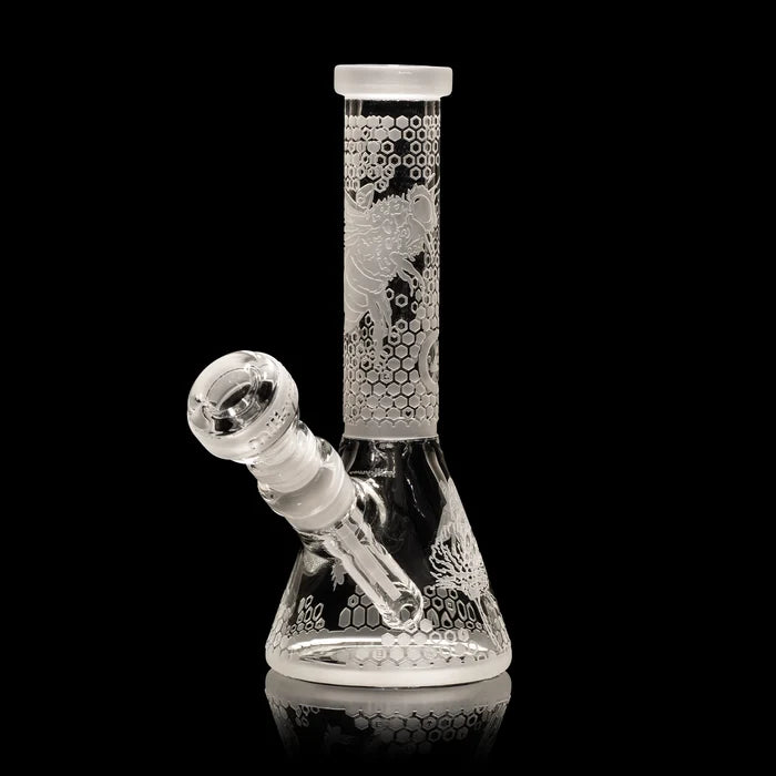 Glass smoking bong device with honeycomb pattern on a black background
