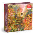 The Laivi Põder Autumn in the Meadow 1000 Piece Puzzle features an illustration of a cozy house amid colorful autumn trees, showcasing vibrant oranges, yellows, greens, and detailed botanical foliage.