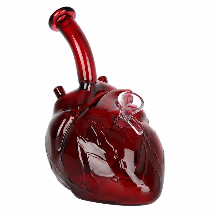 Red glass heart-shaped smoking device on a white background