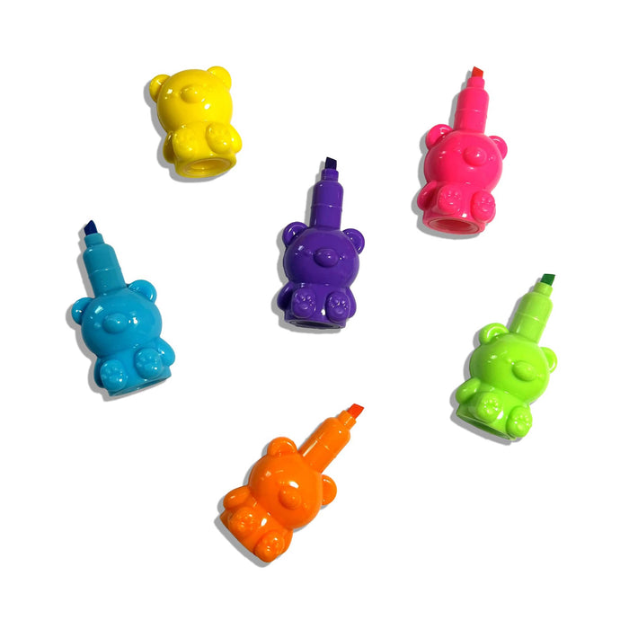 Colorful bear-shaped highlighters, caps off, on a white background.
