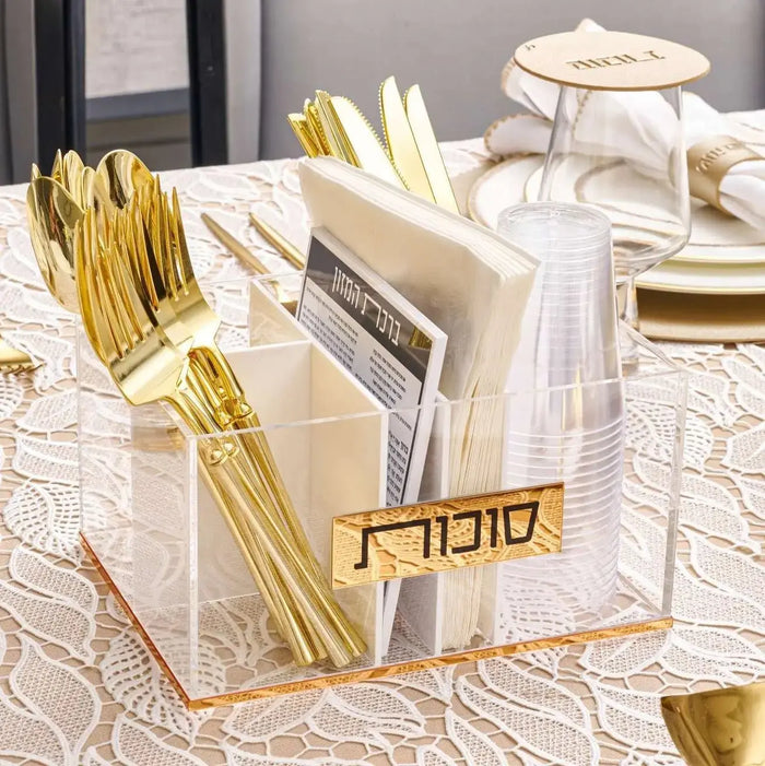 Bencher Silverware Caddy holding cutlery and napkins on a set table, Lucite with gold accents