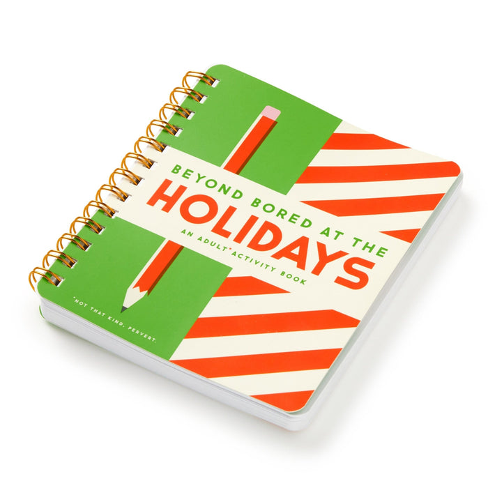 The Brass Monkey Beyond Bored At The Holidays spiral-bound adult activity book features festive brain games and a green and red striped cover with a pencil illustration.