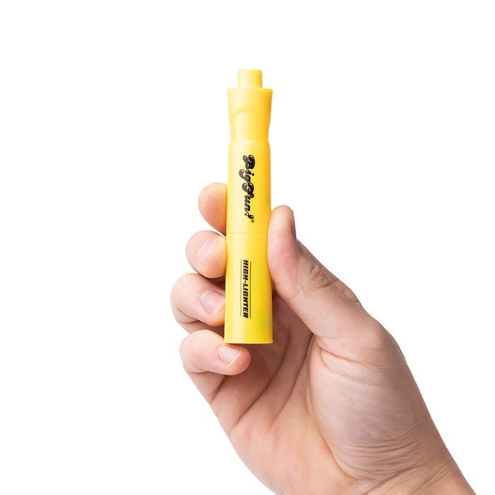 Hand holding a yellow marker that’s actually cart battery on a white background
