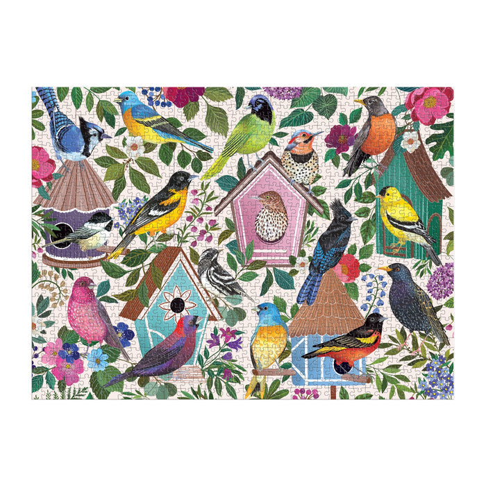 Enjoy assembling the Christine De Carvalho Birdhouse Lane 1000 Piece Puzzle, featuring a colorful array of birds on charming decorative birdhouses with lush leaves and vibrant flowers against a light patterned background.