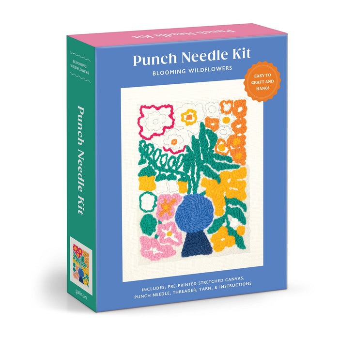 The Liv Lee Blooming Wildflowers Punch Needle Kit features a blue box with a floral design and includes a pre-printed canvas, punch needle, threader, and yarn.