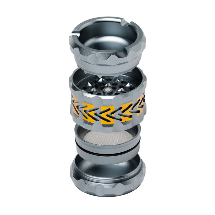 Metallic ashtray grinder with decorative design on a white background