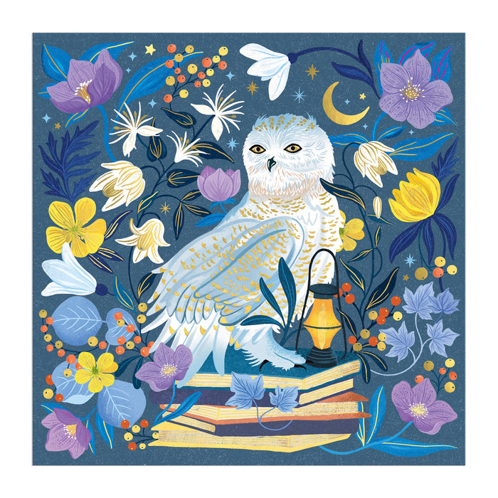An illustrated white owl sits amid vibrant flowers, books, and a glowing lantern beneath a crescent moon on the Dawn Cooper Celestial Owl 500 Piece Foil Puzzle, featuring whimsical yellows, purples, and blues.