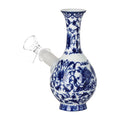Blue and white ceramic bong decanter on a white background