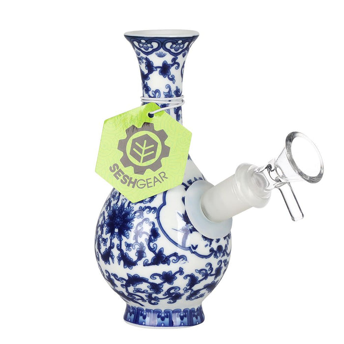 Blue and white ceramic water pipe with a Sesh Gear tag on a white background