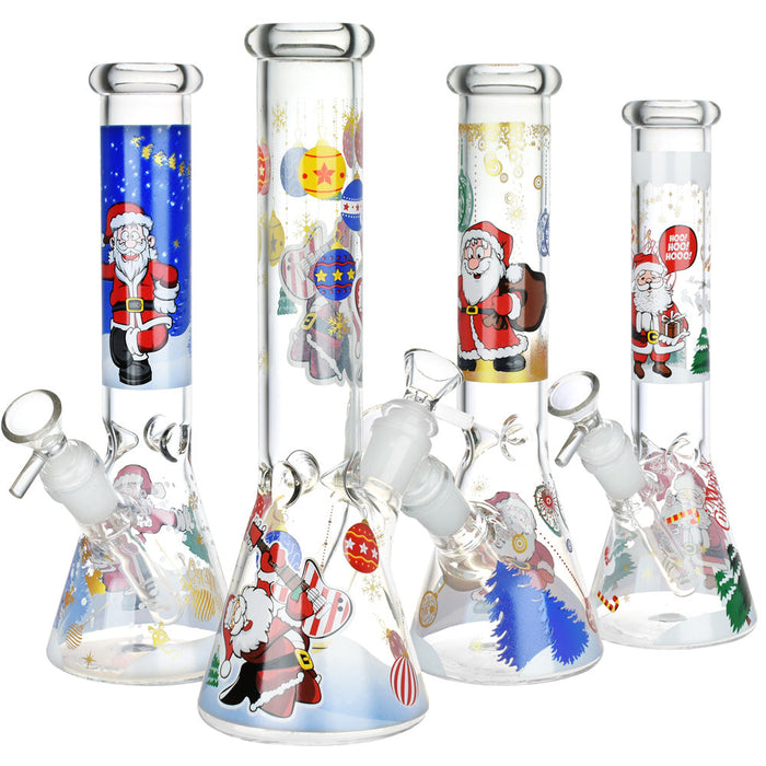 Set of glass beakers with Christmas-themed designs on a white background