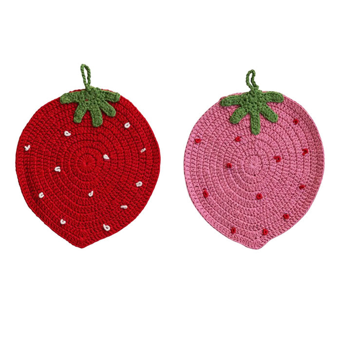 Two strawberry-shaped potholders, one red and one pink, on a white background.