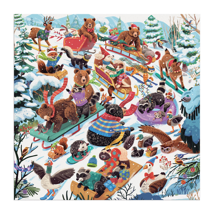 The Dashing All the Way 500 Piece Puzzle by Lucia Baertl features bears, raccoons, owls, foxes, and other woodland animals in winter clothes playing and sledding on a snowy hill among pine trees.