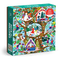 The Deck the Hollows 1000 Piece Puzzle by Flora Waycott features an illustrated winter scene with animals and people decorating treehouses, building snowmen, and celebrating in a snowy forest.