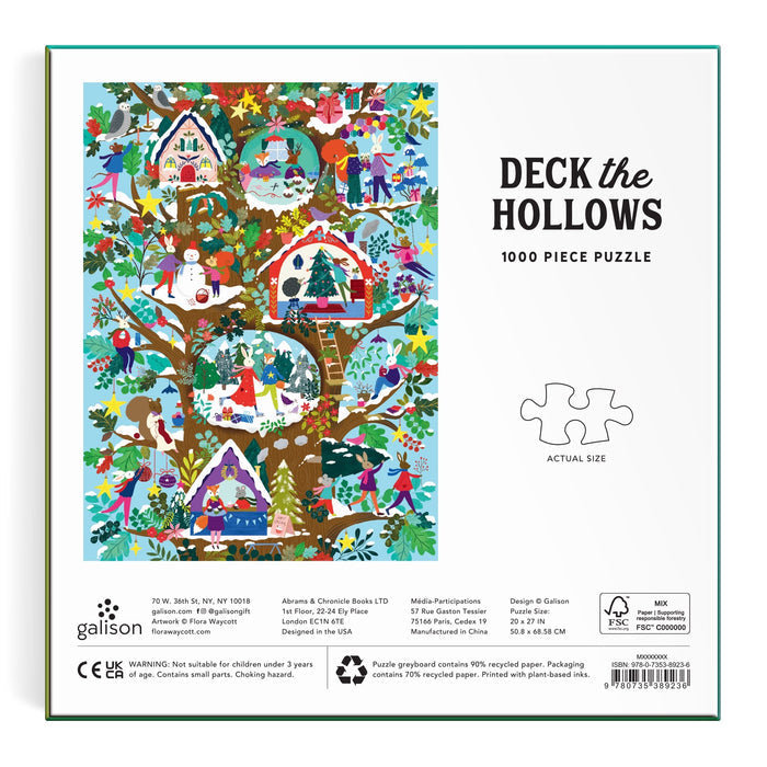 Colorful illustration of animals and people in a festive, snowy forest with decorated treehouses and holiday décor. Text reads "Deck the Hollows 1000 Piece Puzzle" by Flora Waycott, with puzzle piece image and product details.