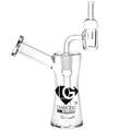 A clear glass mini dab rig with a slitted disc percolator and an angled mouthpiece, featuring the Diamond Glass logo.