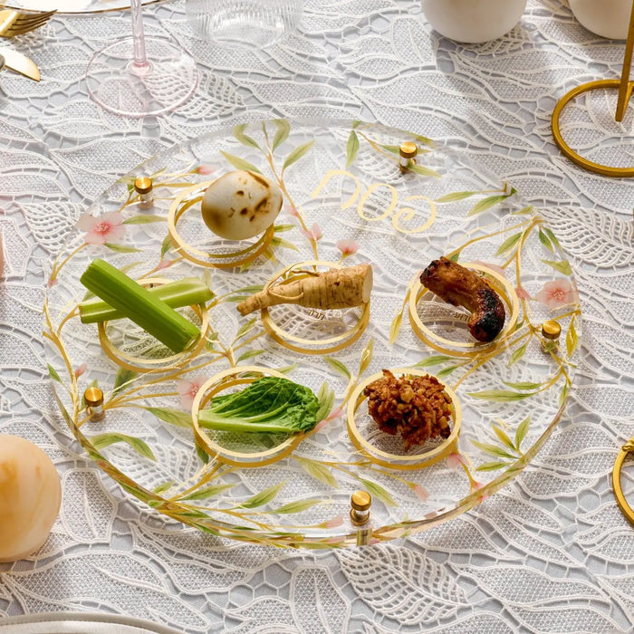 Floral bird seder plate with lucite construction, featuring colorful painted birds and botanical designs around compartments for Passover foods.