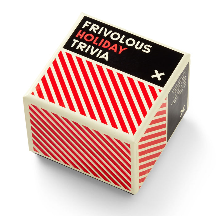 A cube-shaped Brass Monkey Frivolous Holiday Trivia box features bold black, red, and white diagonal stripes—perfect for Christmas trivia—displayed against a white backdrop.