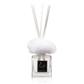 Waterdale Collection fur diffuser with white fuzzy top and clear glass bottle featuring black label and reed sticks for home fragrance.