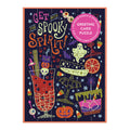 The Get into the Spooky Spirit Greeting Card Puzzle by Camille Chew is a colorful Halloween-themed puzzle featuring festive drinks, a ghost, pumpkin, eyeballs, and cake. The packaging serves as a greeting card with space for your message.