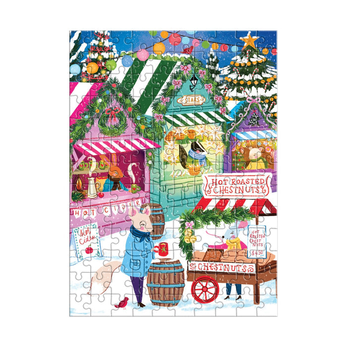 Enjoy a snowy holiday scene with Joanna Clay’s Holiday Market 130 Piece Puzzle Ornament—featuring festive stalls, treats like hot chocolate, and shoppers in winter attire amid wreaths and garlands.