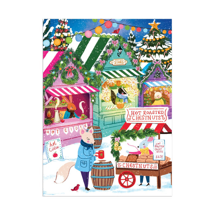 Celebrate the season with Joanna Clay’s Holiday Market 130 Piece Puzzle Ornament, featuring a festive winter scene of animals shopping at colorful stalls with signs for “Hot Roasted Chestnuts” and “Hot Cider,” plus wreaths, string lights, and snow.