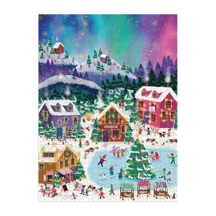 The Joy Laforme Northern Lights 1000 Piece Foil Puzzle features a colorful winter village under the aurora, with people ice skating, playing, and browsing market stalls among snowy houses, trees, and mountains.