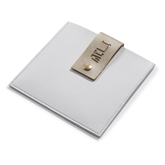 White leatherette Hadlokas Neiros pouch with tan card holder by Waterdale Collection for candle-lighting blessings.