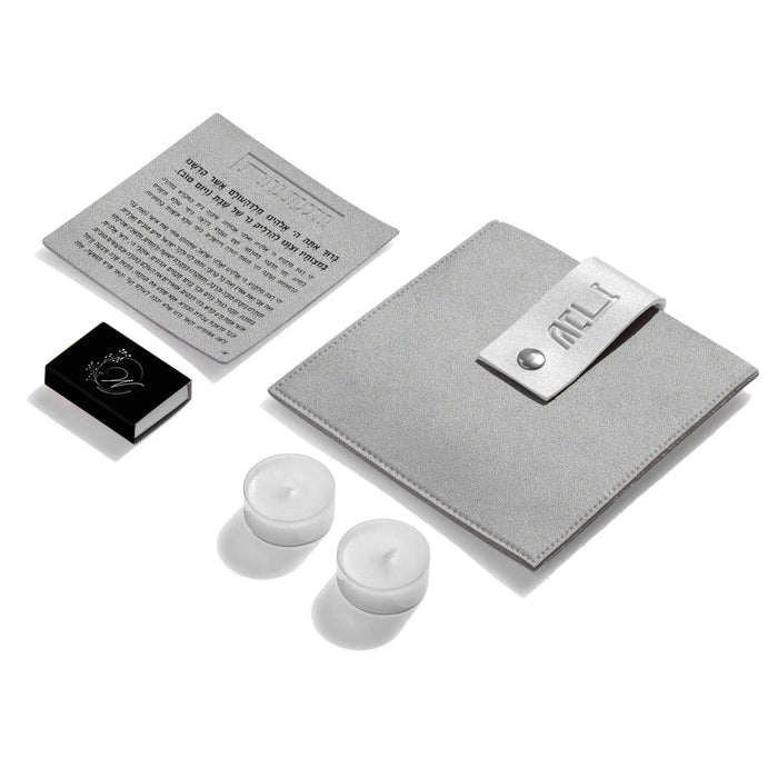 Gray leather hadlokas neiros pouch with lucite candle-lighting cards and white candles included for holiday gift-giving.