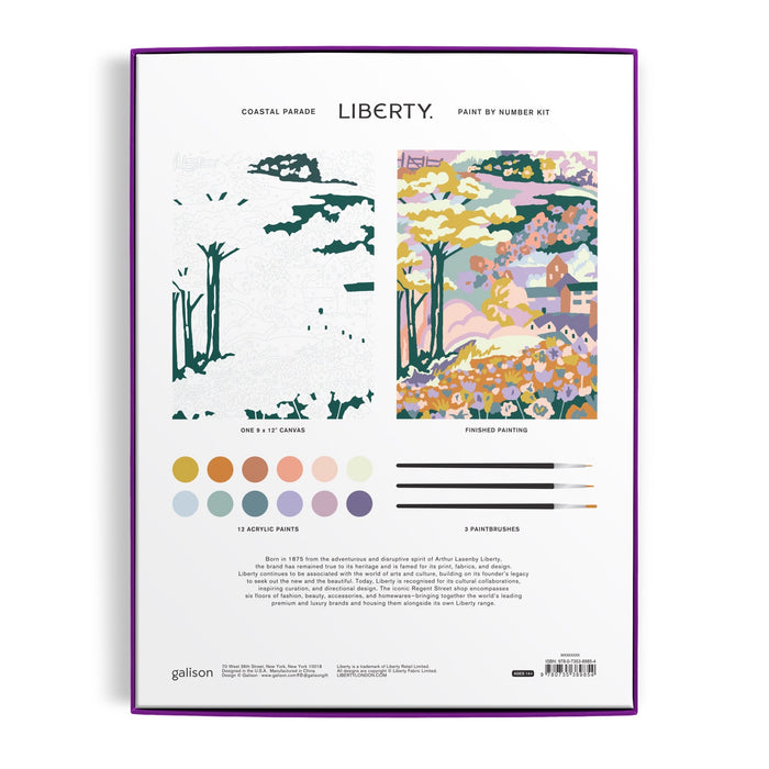 The image displays the back of the Liberty London Coastal Parade 9 x 12" Paint by Number Kit with a pre-outlined canvas, a completed coastal scene, 12 paint colors, and 3 brushes.