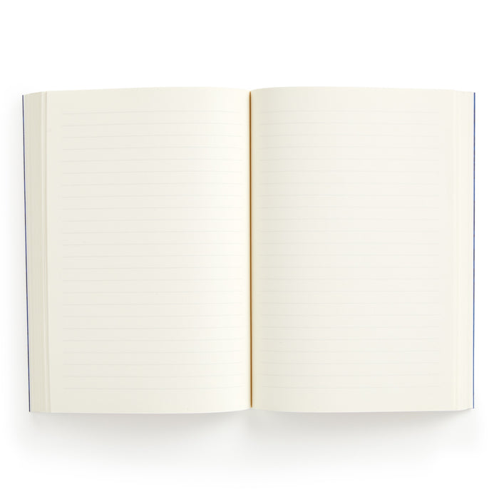 The Liberty Glastonbury Premium A5 Notebook by Liberty London is shown open from above, displaying both blank, lined pages with premium white or light cream paper thats ready for writing.