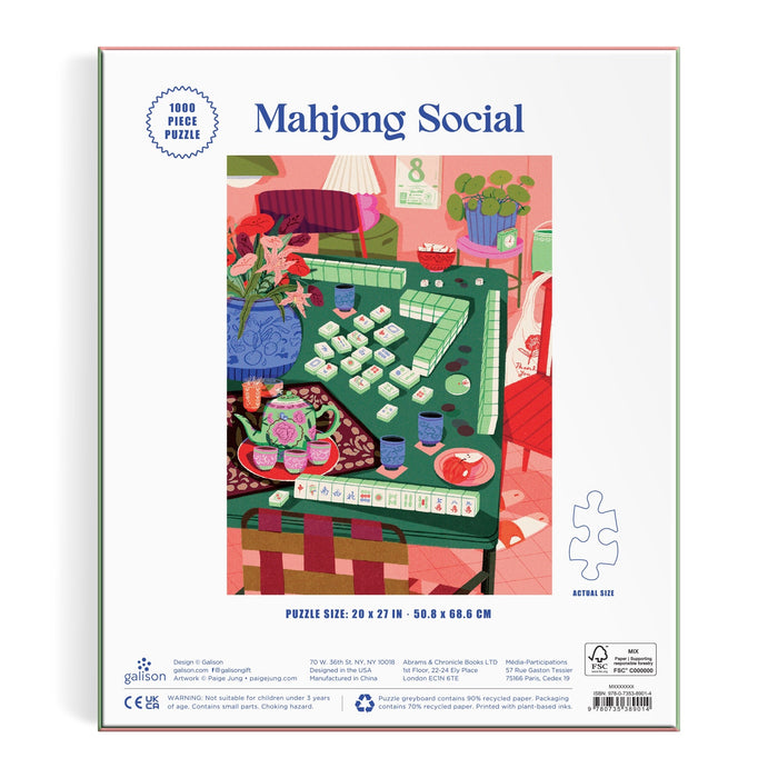 The image displays the back of the Mahjong Social 1000 Piece Puzzle by Paige Jung, featuring a vibrant living room scene with a mahjong game underway on a green table, surrounded by snacks and cozy furniture.
