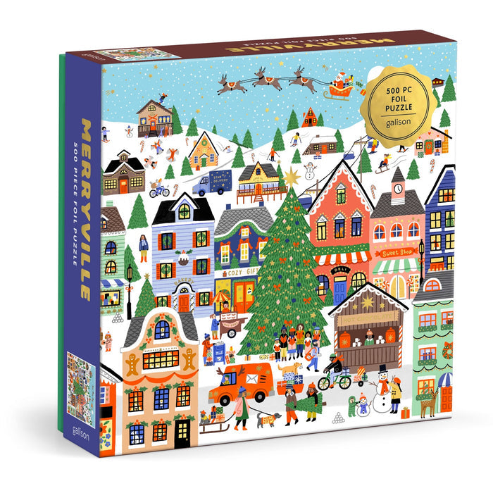 The Holly Maguire Merryville 500 Piece Foil Puzzle features a festive winter village with decorated houses, people ice skating and building snowmen, plus Santa flying overhead.