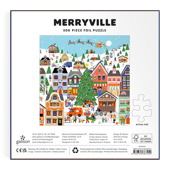 The image shows the back of the Merryville 500 Piece Foil Puzzle by Holly Maguire. The box features a festive village scene with people, houses, a large Christmas tree, and snowy hills.