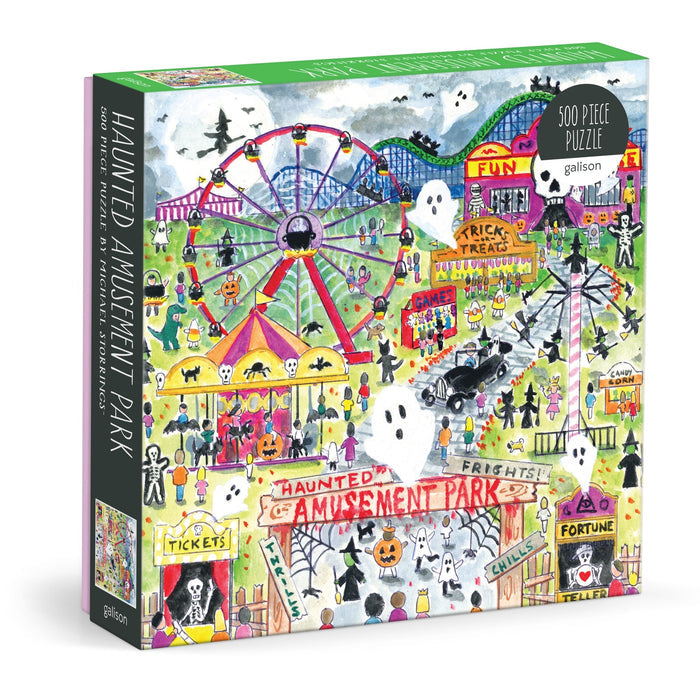 The Michael Storrings Haunted Amusement Park 500 Piece Puzzle by Michael Storrings features a vibrant haunted amusement park scene with ghosts, jack-o’-lanterns, carnival rides, creepy booths, and spooky night decorations.