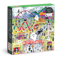 The Michael Storrings Haunted Amusement Park 500 Piece Puzzle by Michael Storrings features a vibrant haunted amusement park scene with ghosts, jack-o’-lanterns, carnival rides, creepy booths, and spooky night decorations.
