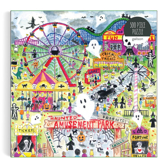 The Michael Storrings Haunted Amusement Park 500 Piece Puzzle by Michael Storrings features a lively haunted amusement park scene with costumed visitors, ghosts, jack-o’-lanterns, ferris wheel, carnival games, and Halloween decor.