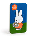 The Miffy Sticker Tin by Miffy features a rectangular design with a cartoon of Miffy holding flowers on a blue and green background, plus an orange label that reads "225+ miffy stickers" in the top left corner.