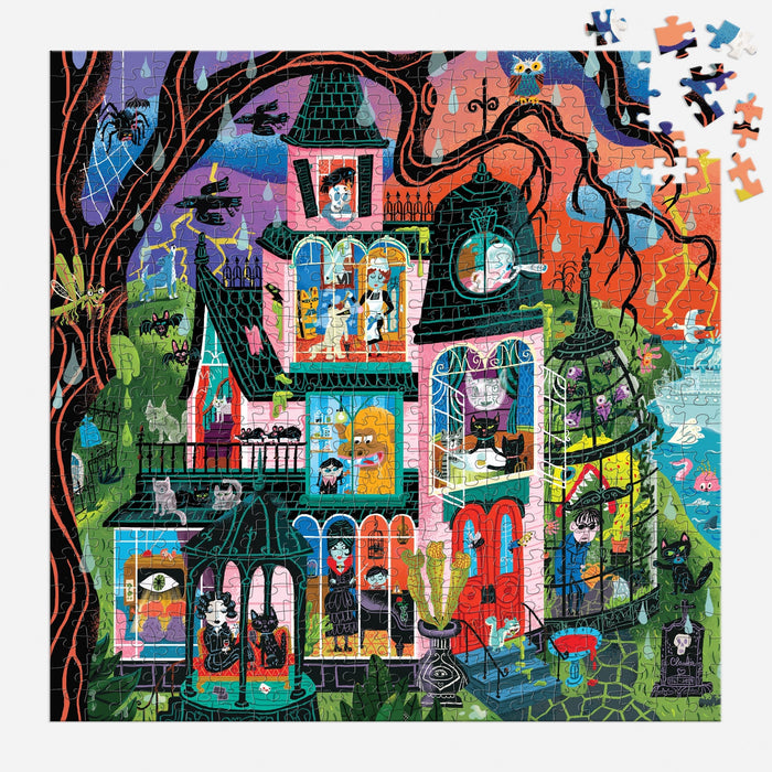 Experience festive fun with the Monster Mansion 500 Piece Puzzle by Stephanie Birdsong, featuring a vibrant illustration of a spooky Victorian-style house complete with black cats, ghosts, bats, and witches. Watch as the puzzle comes together piece by piece in the top right corner, capturing the image in progress. This family-friendly puzzle is perfect for hours of Halloween entertainment!.