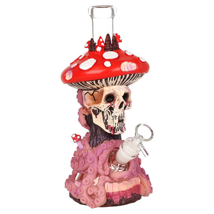 Decorative glass bong with skull and mushroom design on a white background