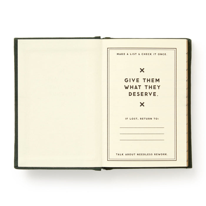An open Brass Monkey Naughty and/or Nice Tiny Diary displays “Make a list & check it once. Give them what they deserve. If lost, return to:” with blanks, and “Talk about needless rework” handwritten in this pocket-sized Christmas journal.