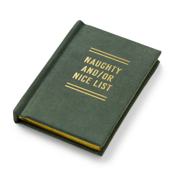 The Brass Monkey Naughty and/or Nice Tiny Diary is a green, pocket-sized Christmas journal with gold “NAUGHTY AND/OR NICE LIST” text on the cover, shown closed at an angle against a white background.
