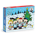 The Peanuts Christmas Caroling 1000 Piece Puzzle by Peanuts Worldwide, LLC features beloved characters caroling by a decorated tree in a snowy, festive setting.
