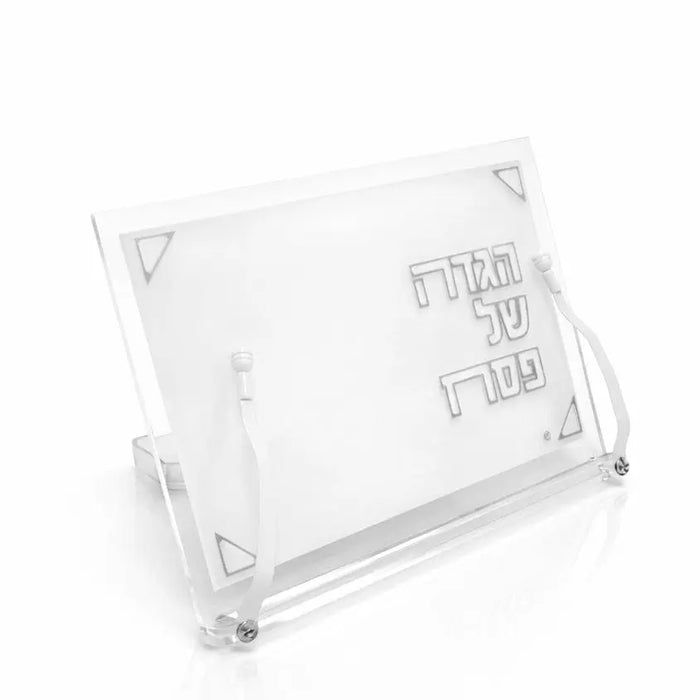 Clear lucite Pearlstone Haggadah stand with pearl marble accents, tilted display angle showing front panel with text, ideal for Pesach table settings.