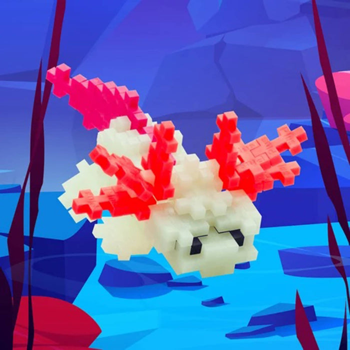 Finished axolotl build in an underwater setting with rocks and plants.