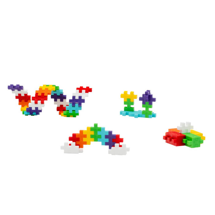 Colorful toy building blocks in different shapes, on a white background.
