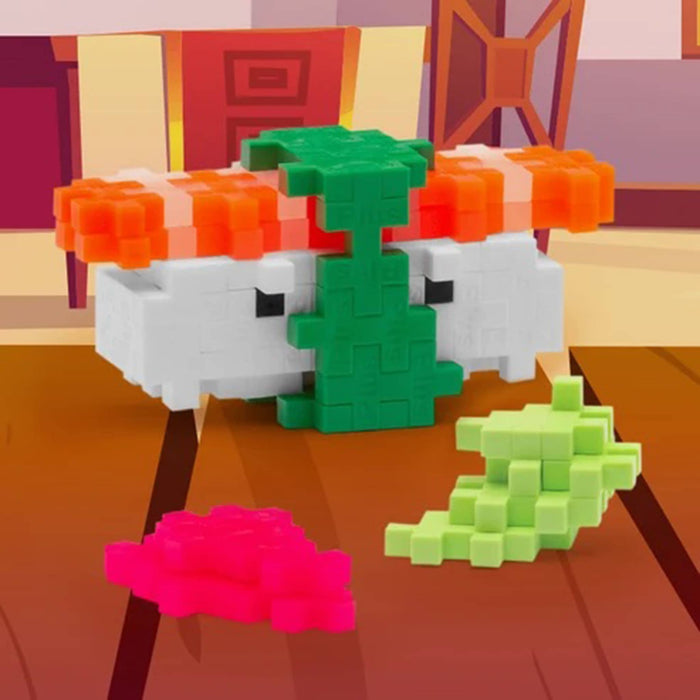 Toy building blocks shaped like sushi and seaweed on a wooden surface.