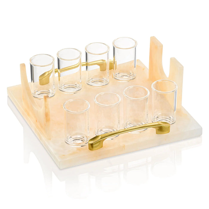 Cream resin liquor and wine serving set with multiple glasses and matching bottle holder on white base, by Waterdale Collection