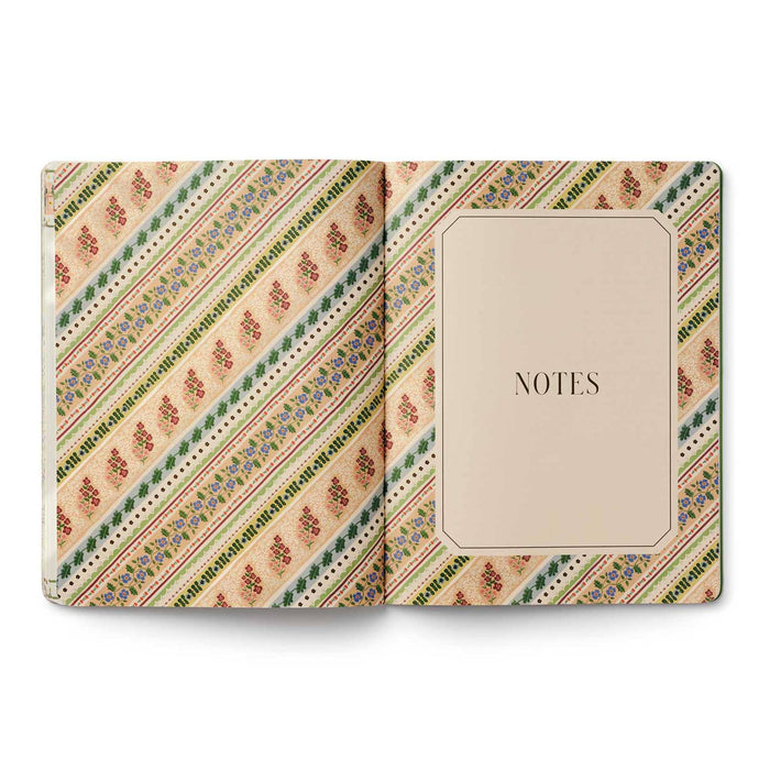 An open 2026-2027 academic planner from Rifle Paper Co. with a 'NOTES' page on the right and a decorative striped pattern on the left, shown against a plain white background.