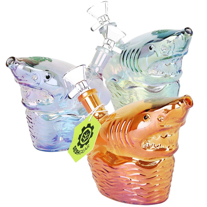 Colorful shark-shaped glass pipes with a visible brand tag on a white background